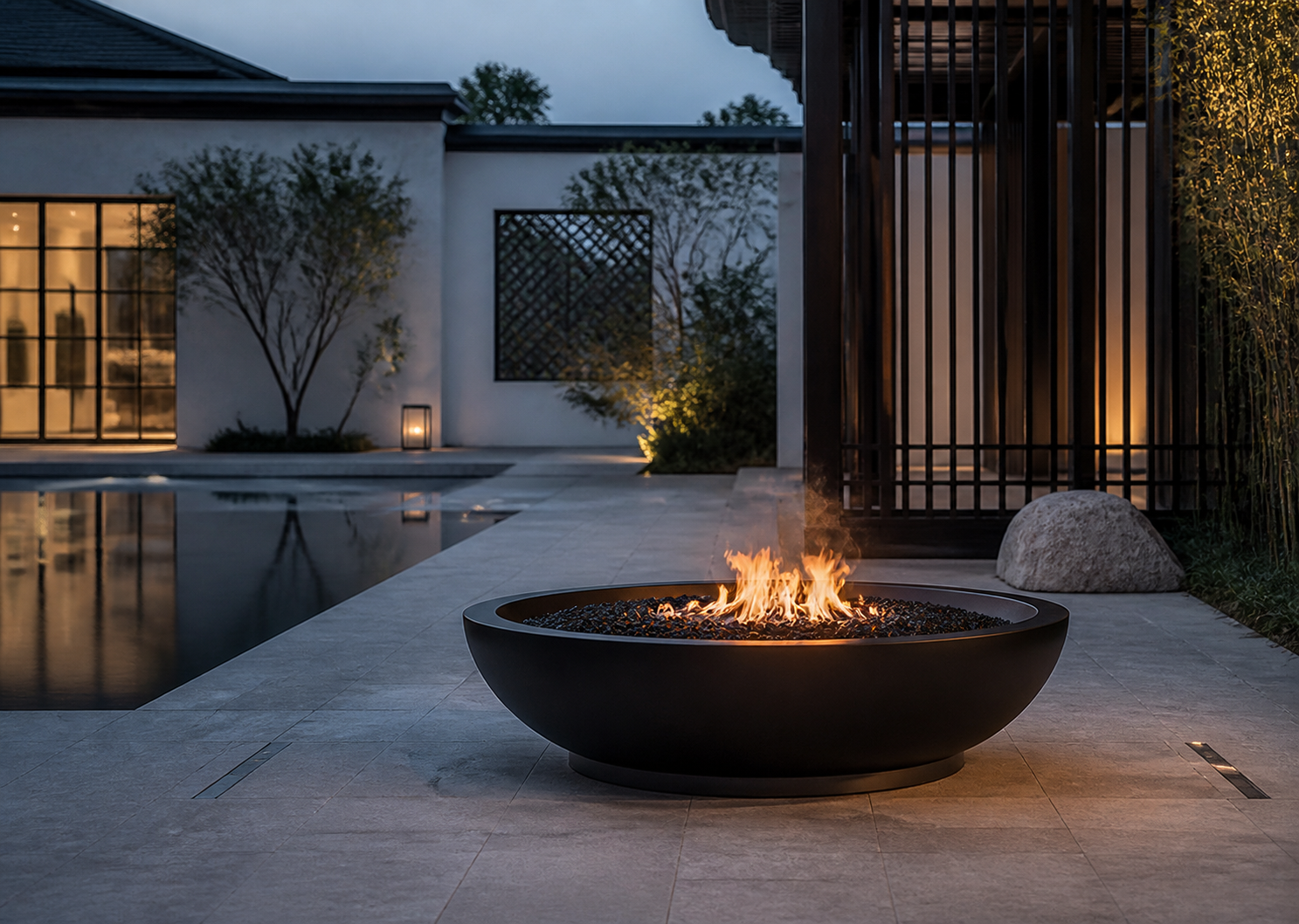 Round ethanol fire feature in an architectural courtyard