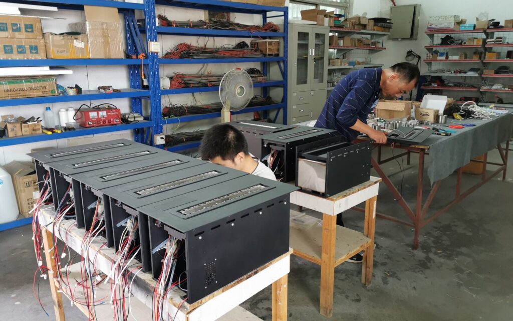 SXFireplace workers assembling intelligent ethanol burner systems