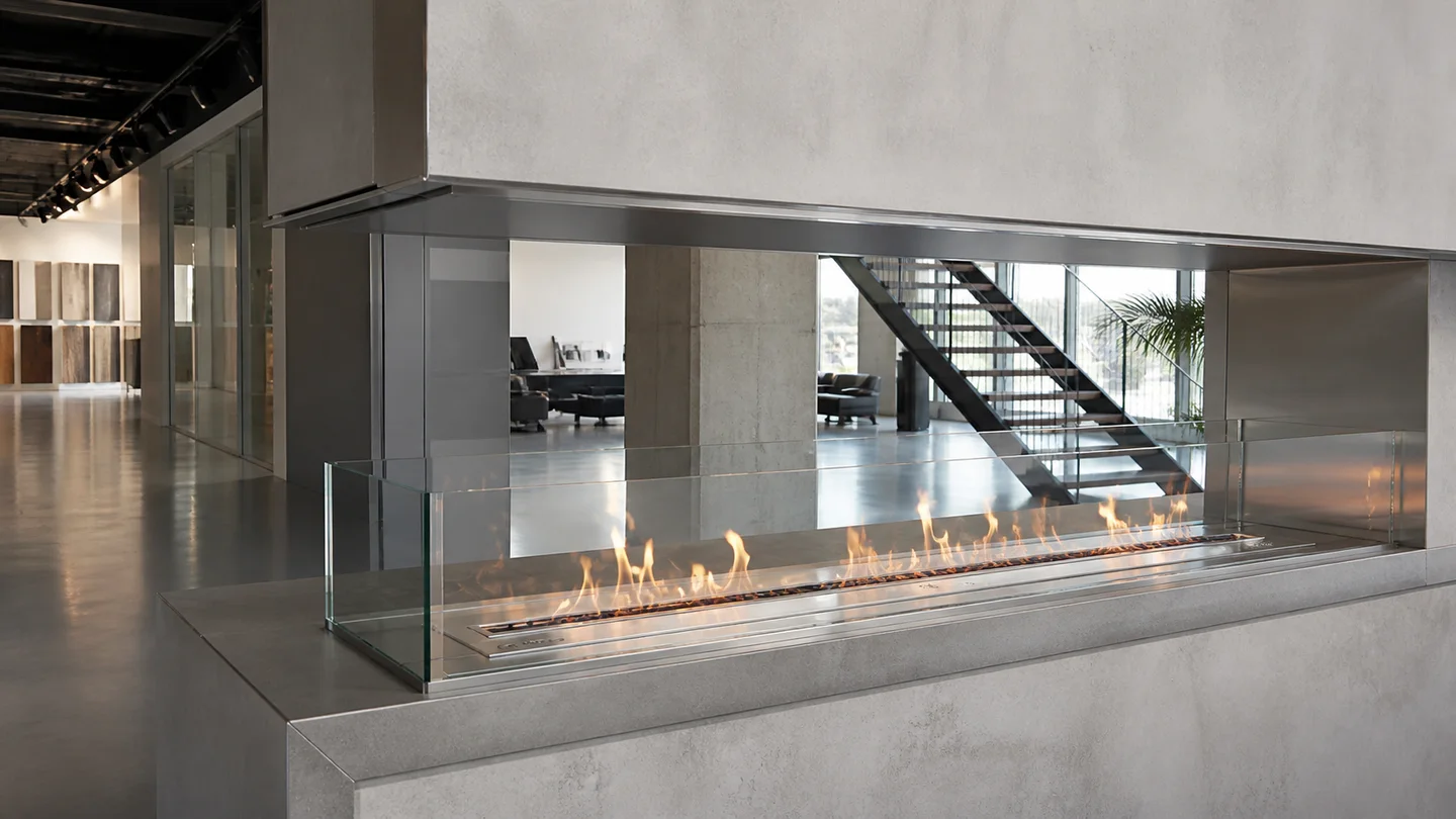 Long intelligent ethanol fireplace installed in a contemporary showroom