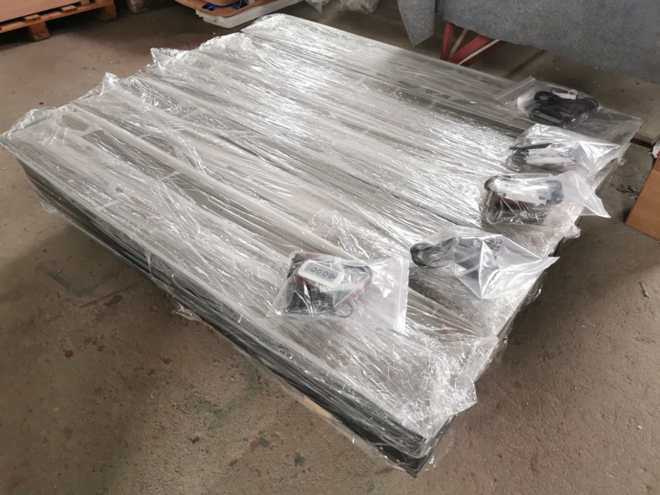 Wrapped linear fireplace units with individually bagged controls and cables.