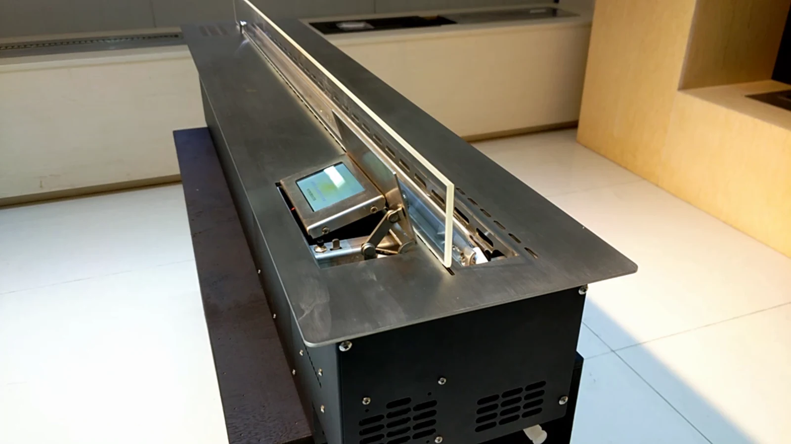 Historical KT operation-video frame showing the on-unit touchscreen