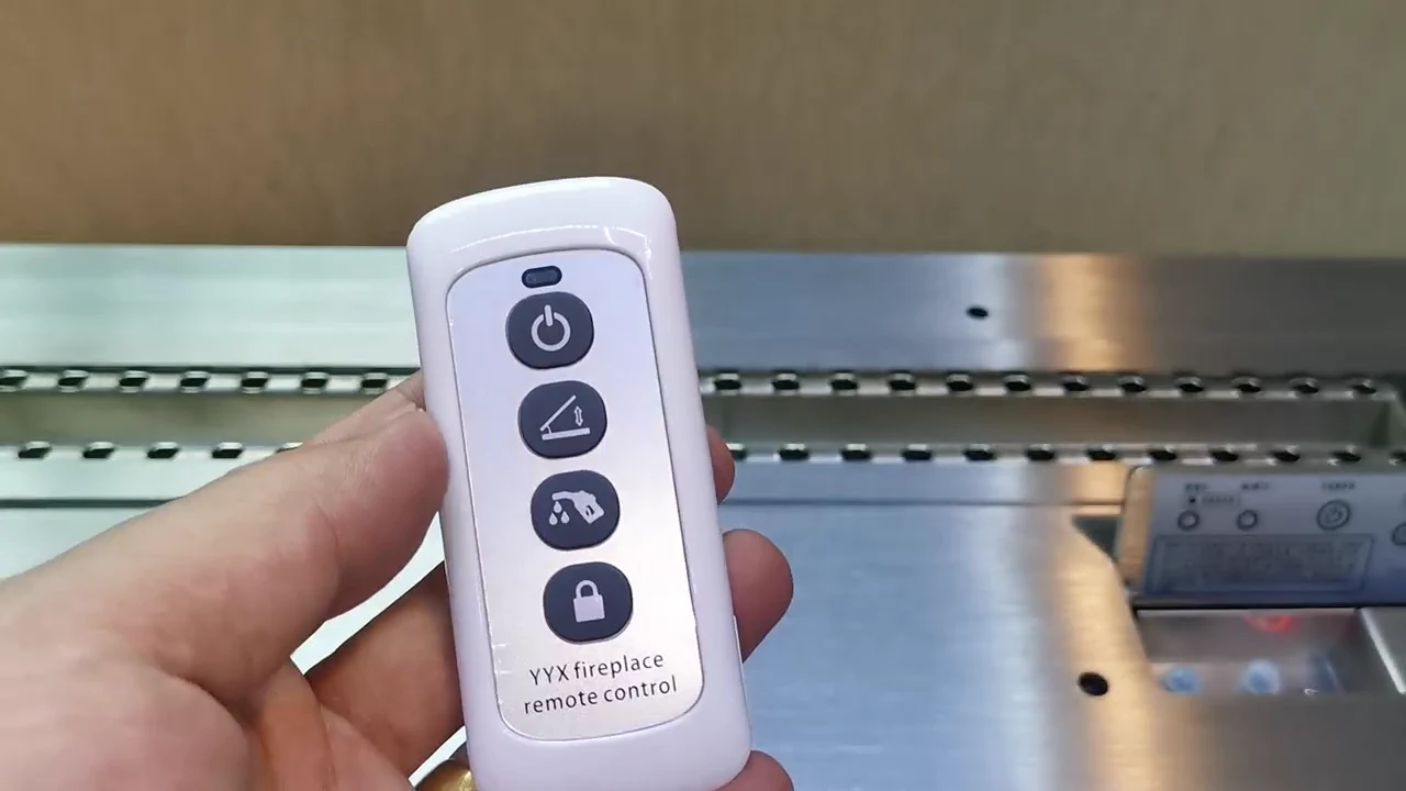 Historical RX operation-video frame showing a handheld remote and on-unit controls