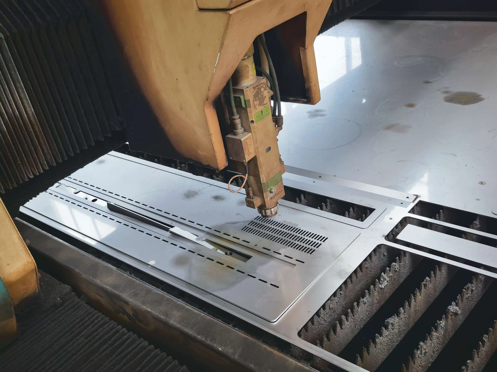 Factory archive photo of laser cutting a metal sheet
