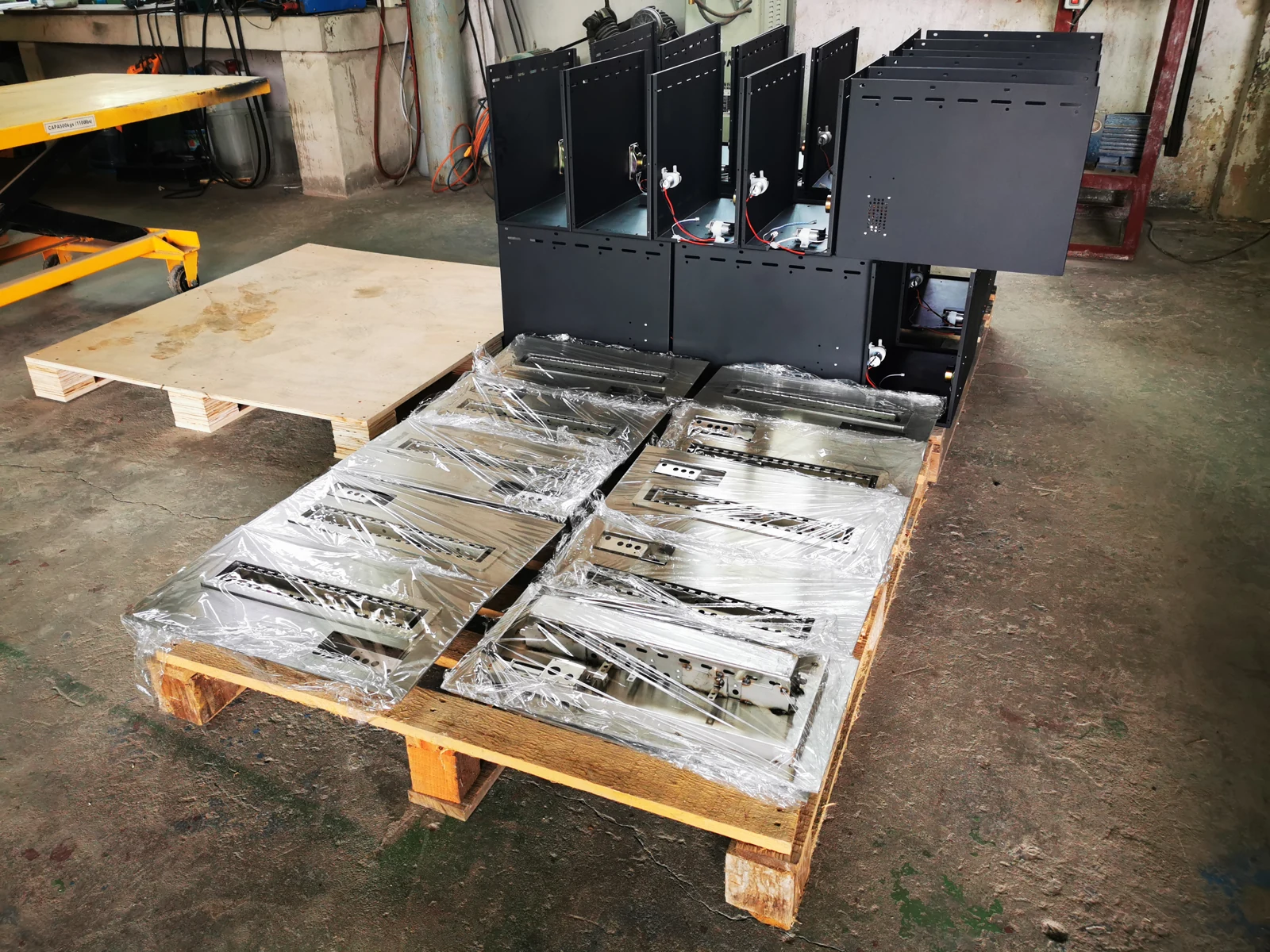 Factory archive photo of unfinished burner bodies and top plates