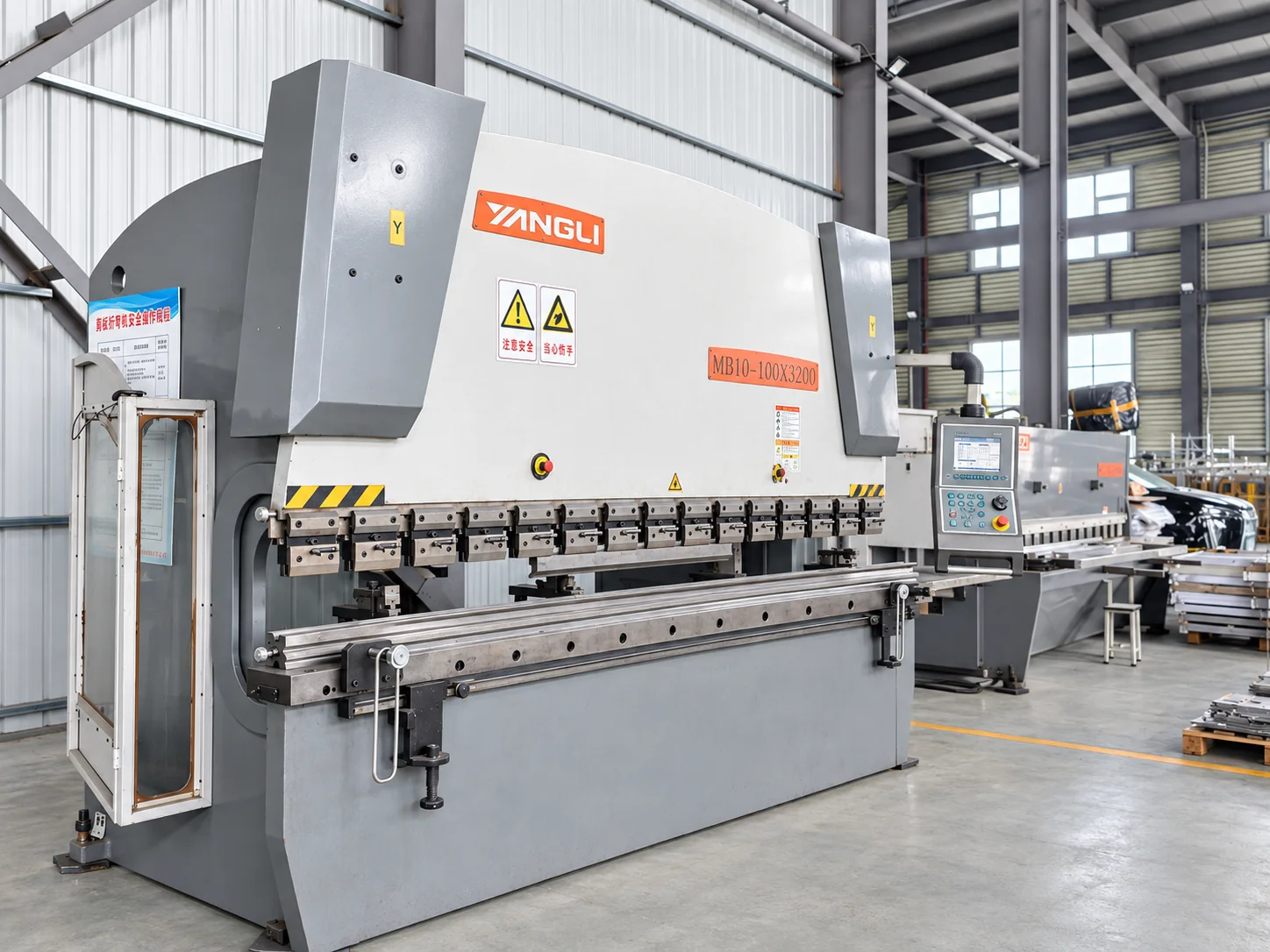 Press brake with sheet-metal bending tooling and a control console